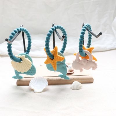 खाद्य ग्रेड सिलिकॉन बेबी Teether गैर विषैले डिजाइन और आसान पकड़ हैंडल के साथ BPA मुक्त सिलिकॉन Teething रिंग